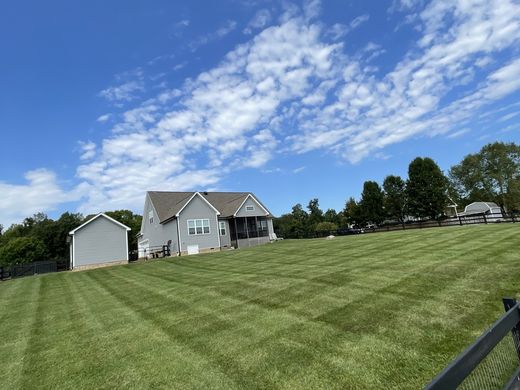 Large maintained lawn and home from OJ LANDSCAPE Facebook